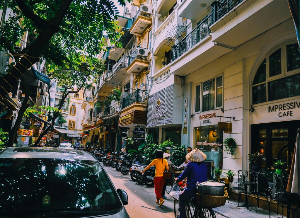 Photo by Arnie Chou from Pexels: https://www.pexels.com/photo/people-walking-in-front-of-buildings-1004122/